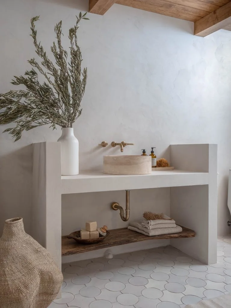 Microcement bathroom vanity and wall finish in a Mediterranean style