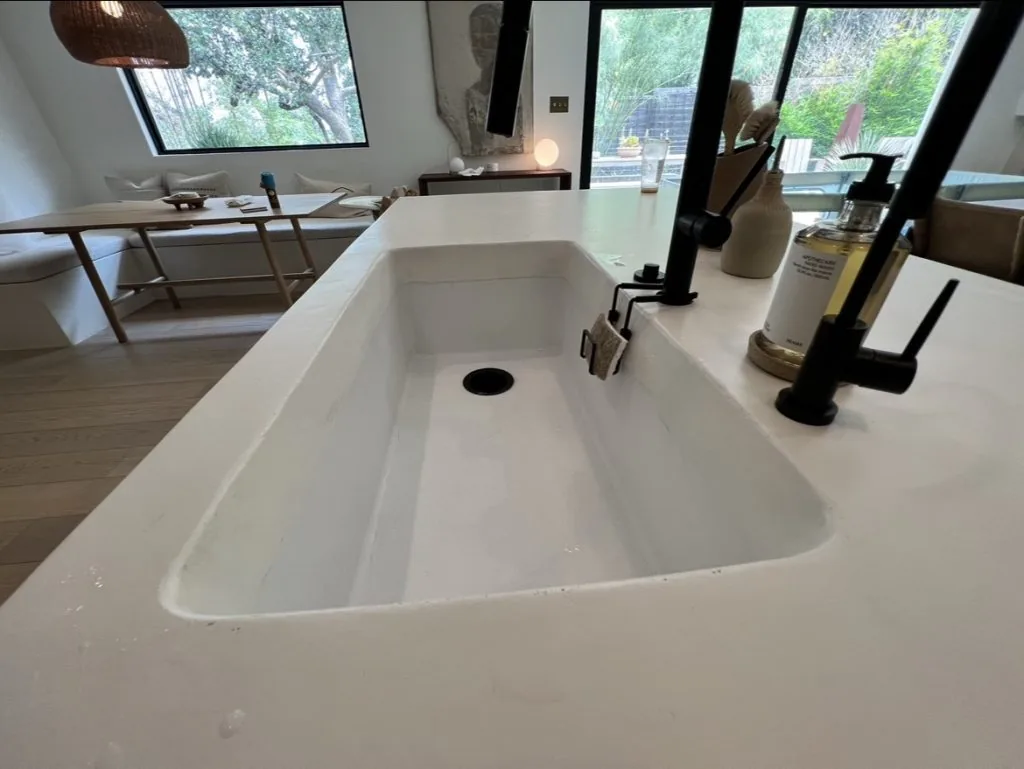 Large microcement kitchen island with seamless integrated sink